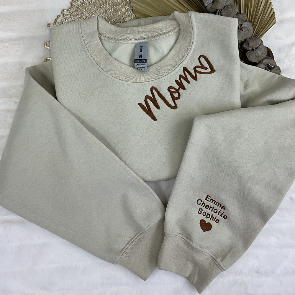 a couple of sweatshirts sitting on top of a bed