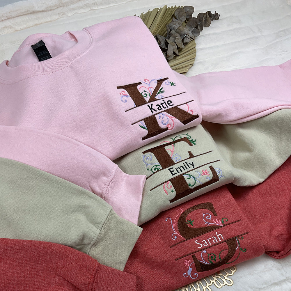 a pile of clothing sitting on top of a bed