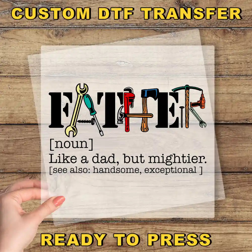 a hand holding a piece of paper with a picture of tools on it