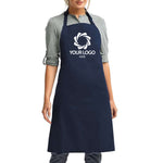 a woman wearing an apron with a logo on it
