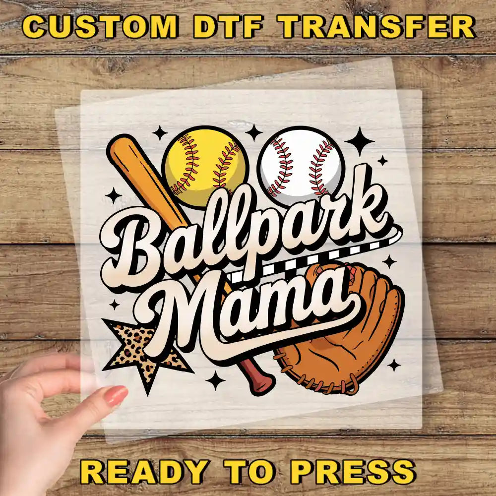 a hand holding a paper with a baseball and ball on it