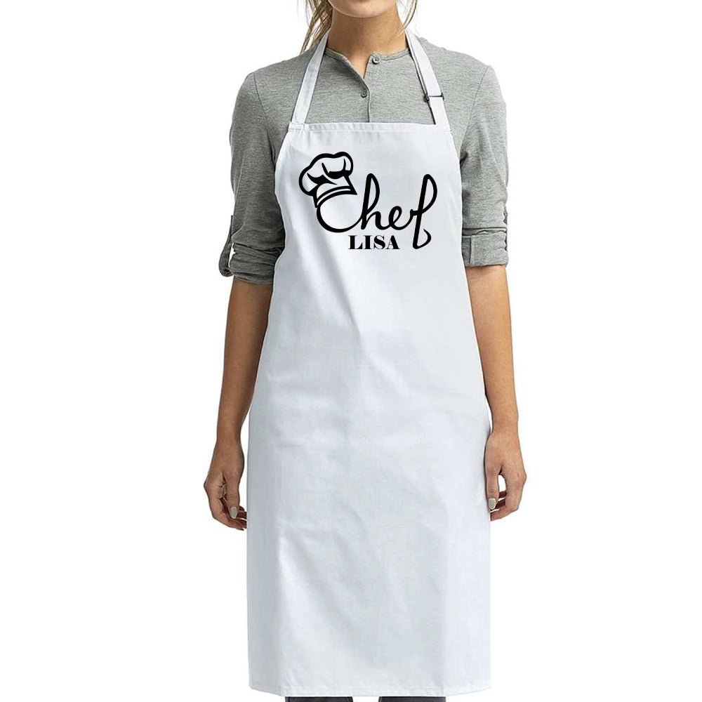 a woman wearing a chef's apron and smiling