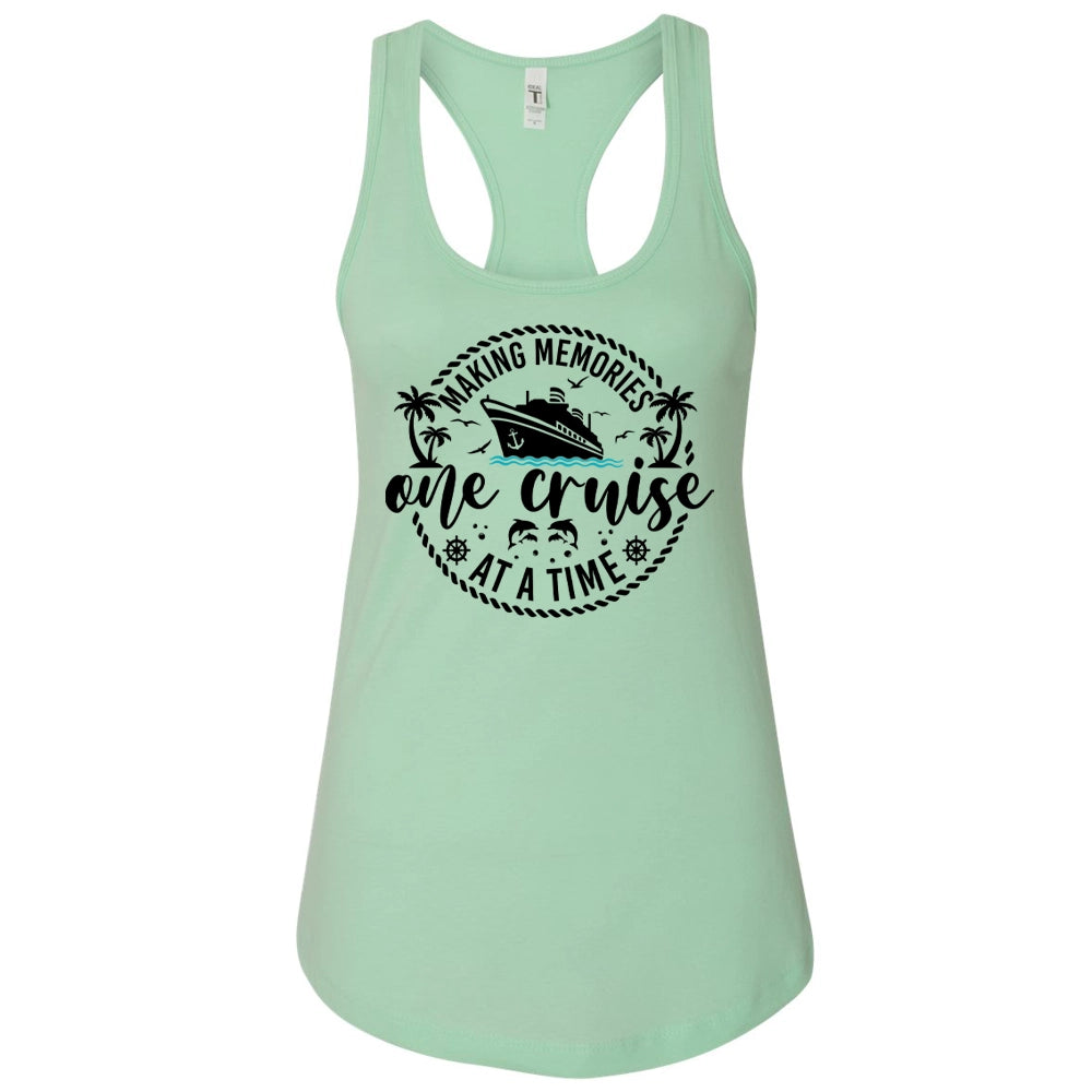A mint green tank top with a graphic design featuring a cruise ship and the text "Making memories one cruise at a time".
