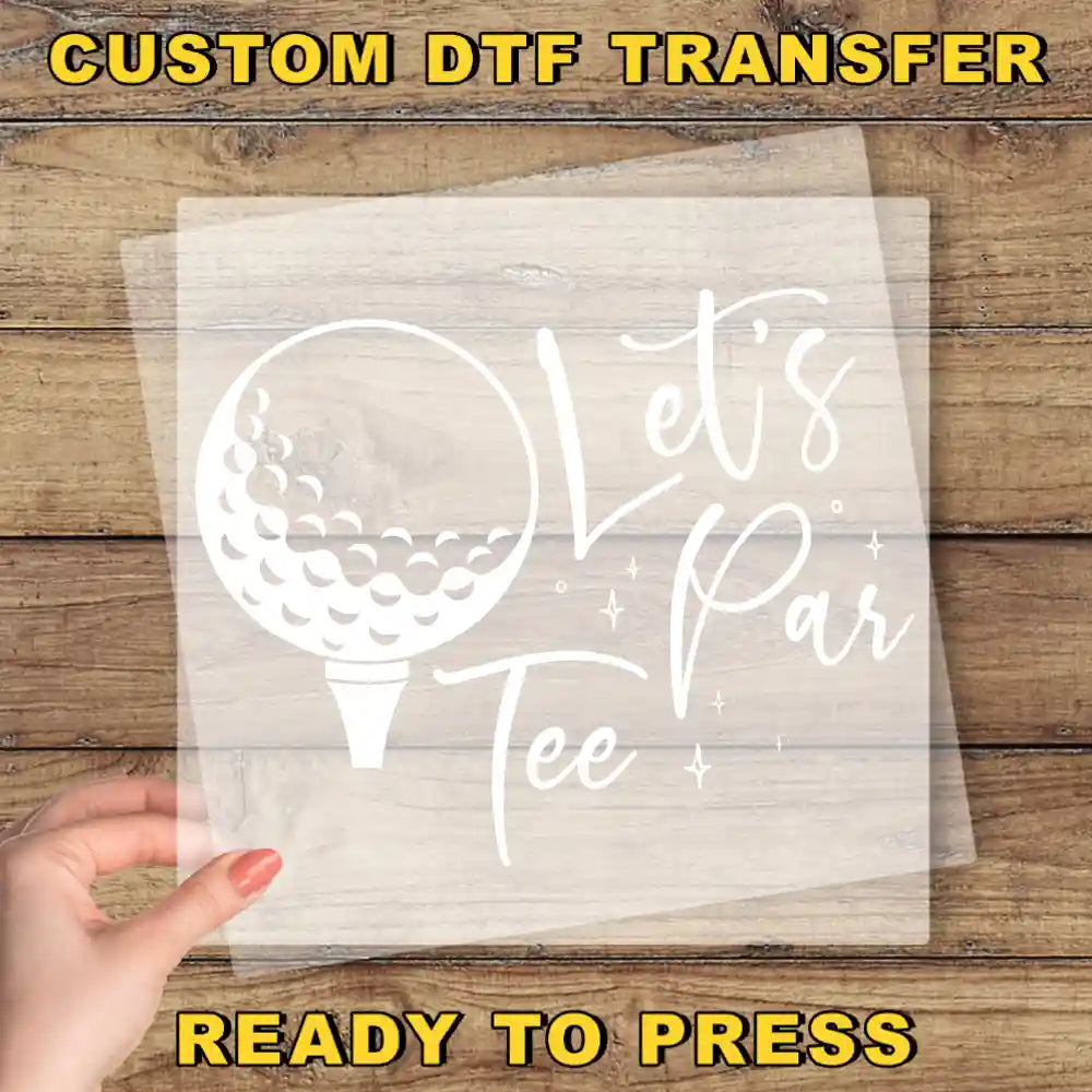 a person holding a piece of paper with a golf ball on it