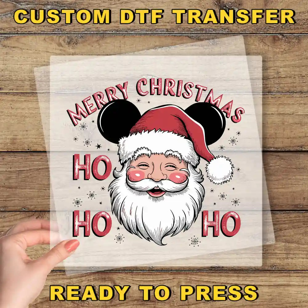 a hand holding a piece of paper with a santa clause on it