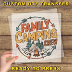a person holding up a paper with the words family camping crew on it