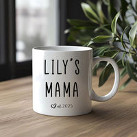 a white coffee mug sitting on top of a wooden table