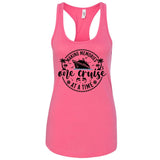 A pink tank top with a graphic design featuring a cruise ship and the text "Making memories one cruise at a time".