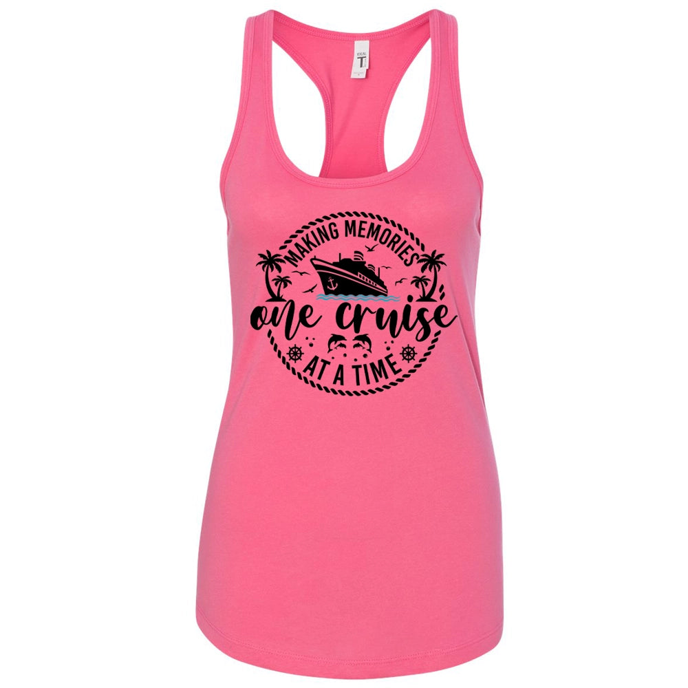A pink tank top with a graphic design featuring a cruise ship and the text "Making memories one cruise at a time".