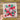 a person holding a piece of paper with flowers and strawberries on it