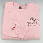 a pink sweatshirt with a picture of a dog and a heart on it