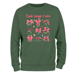 a green sweatshirt with pink bows on it