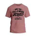 A pink t-shirt with a graphic design featuring the text "ARE YOU FALL-O-WEEN JESUS?" along with a pumpkin and the text "MATTHEW 4:19" below it.