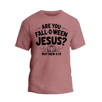A pink t-shirt with a graphic design featuring the text "ARE YOU FALL-O-WEEN JESUS?" along with a pumpkin and the text "MATTHEW 4:19" below it.