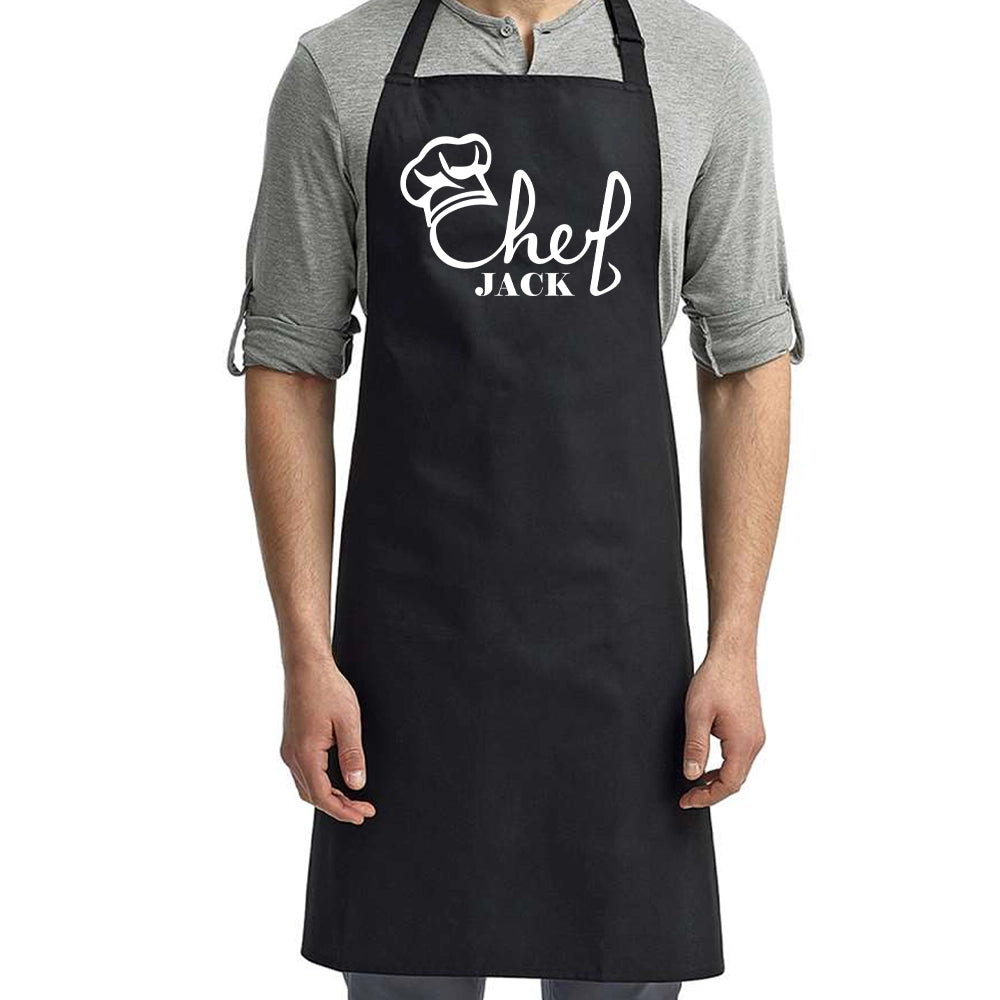 a man wearing a black chef's apron