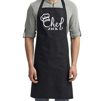 a man wearing a black chef's apron