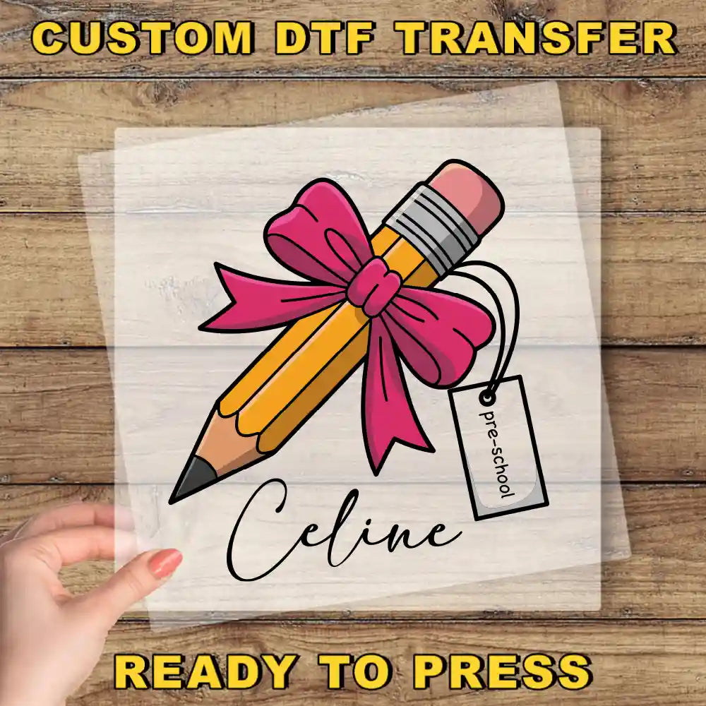 a hand holding a transparent sheet with a pencil and a pink ribbon, with the name "Celine" written below it.