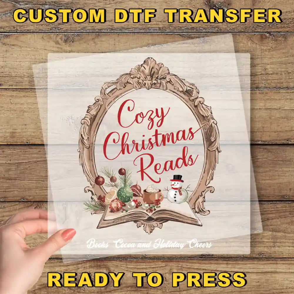 a hand holding a paper with the words cozy christmas reads on it