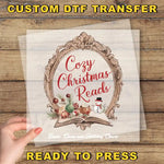 a hand holding a paper with the words cozy christmas reads on it