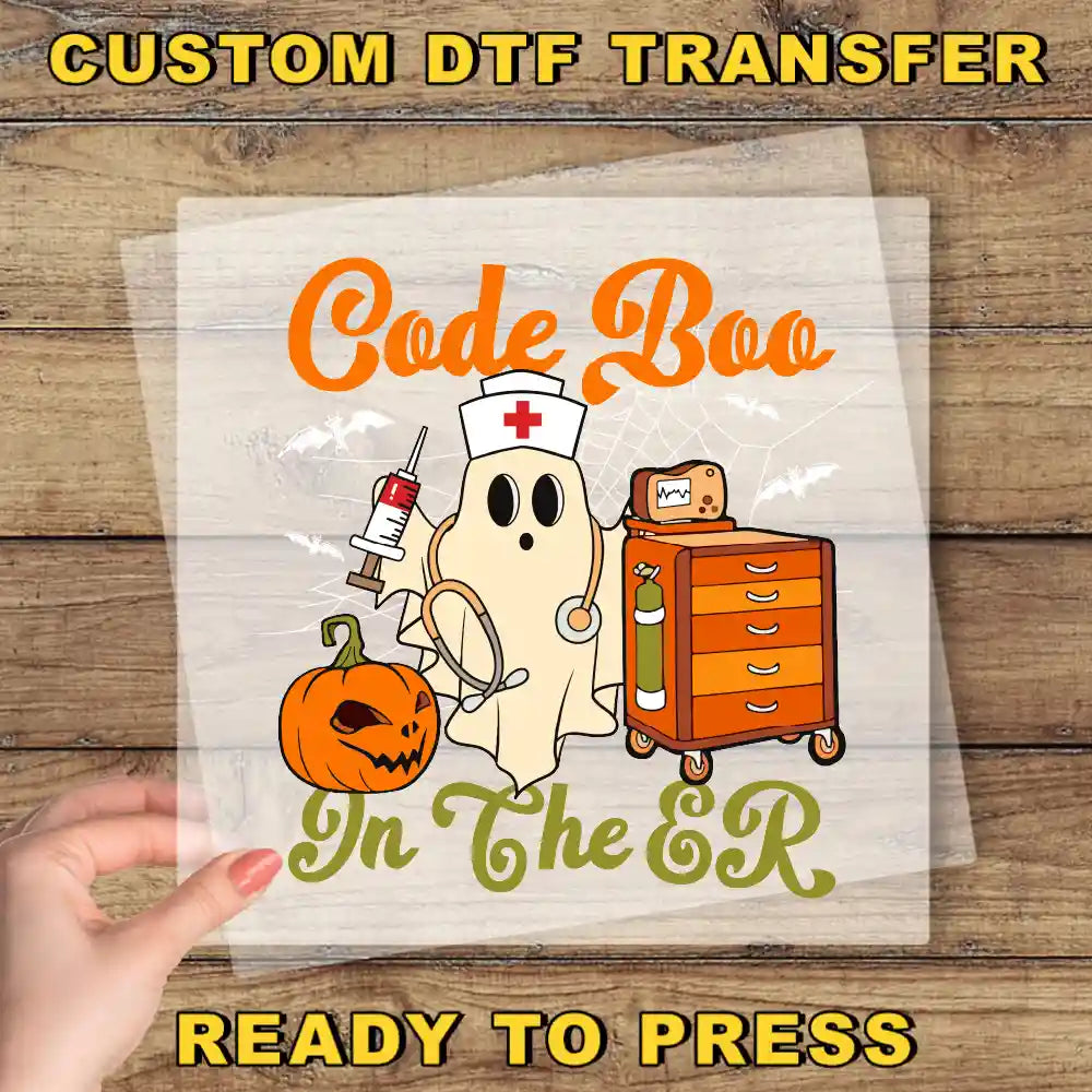 a hand holding a paper with a picture of a ghost on it