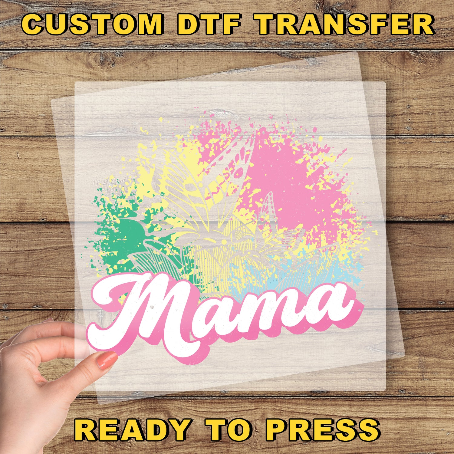 a person holding a piece of paper with the word mama on it