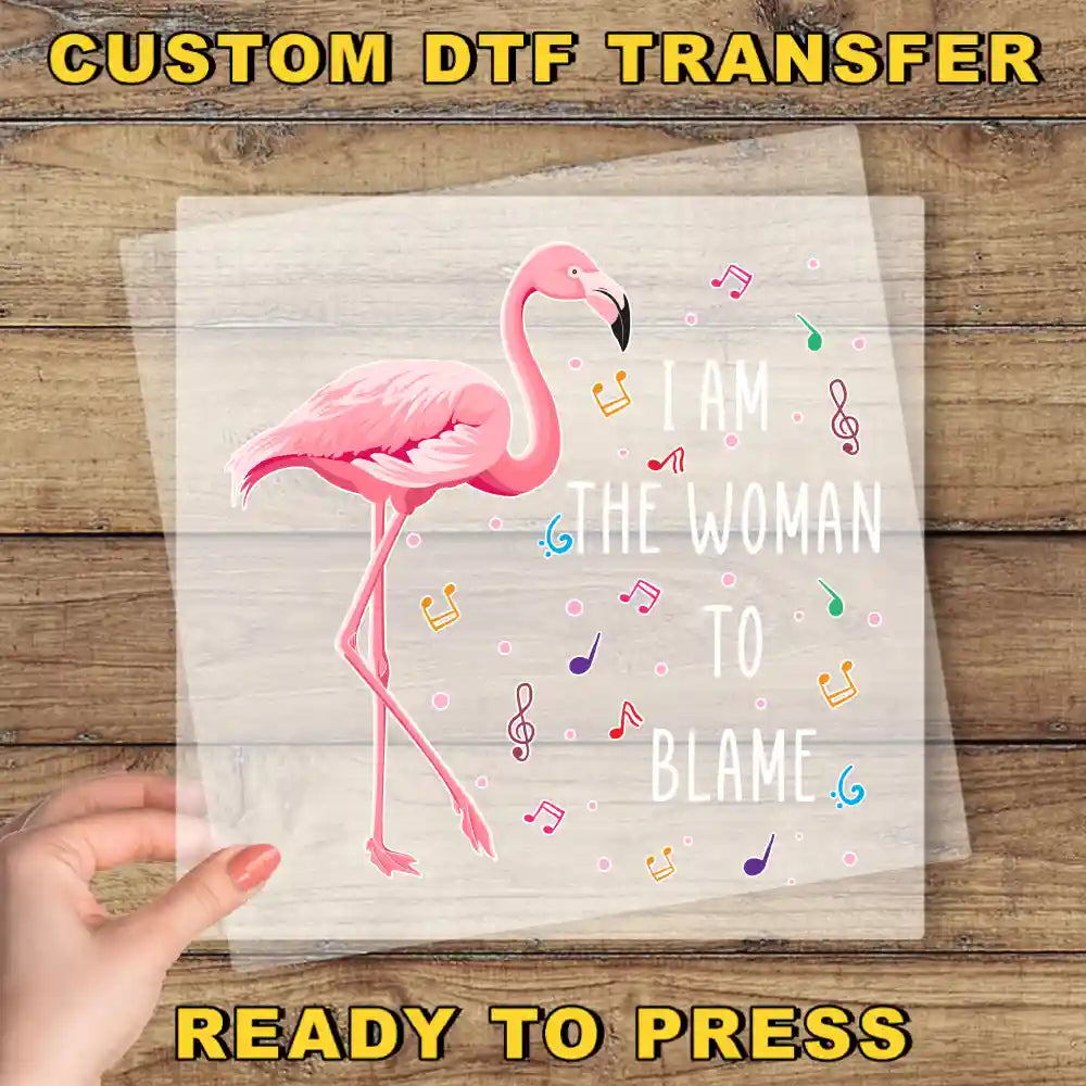 a person holding up a piece of paper with a flamingo on it