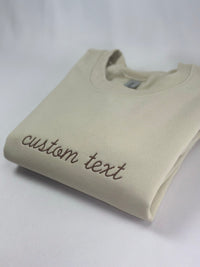 a white t - shirt with the word custom text on it