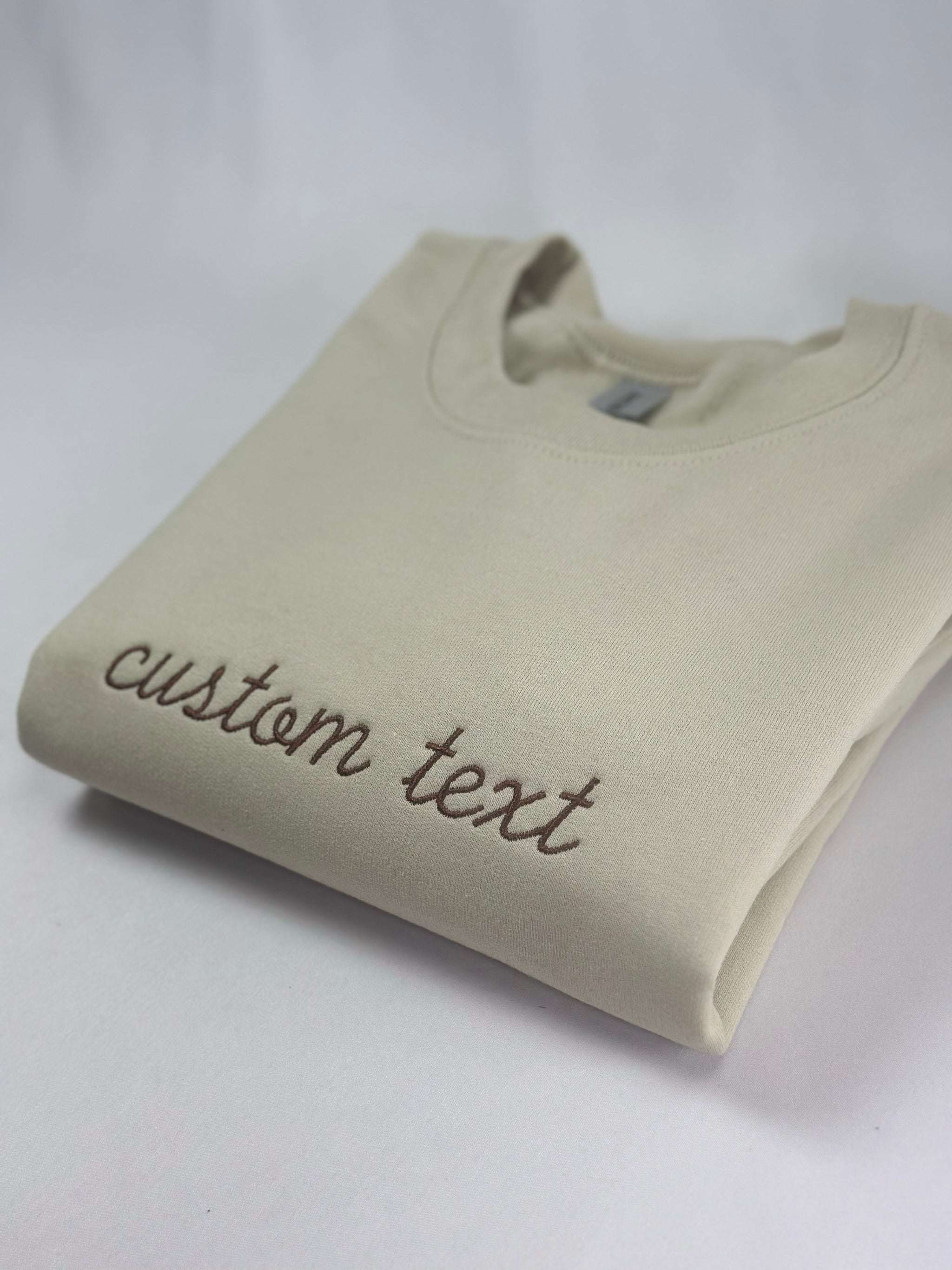 a white t - shirt with the word custom text on it
