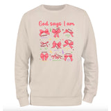 a white sweatshirt with pink bows on it