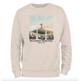 a white sweatshirt with a cross on it