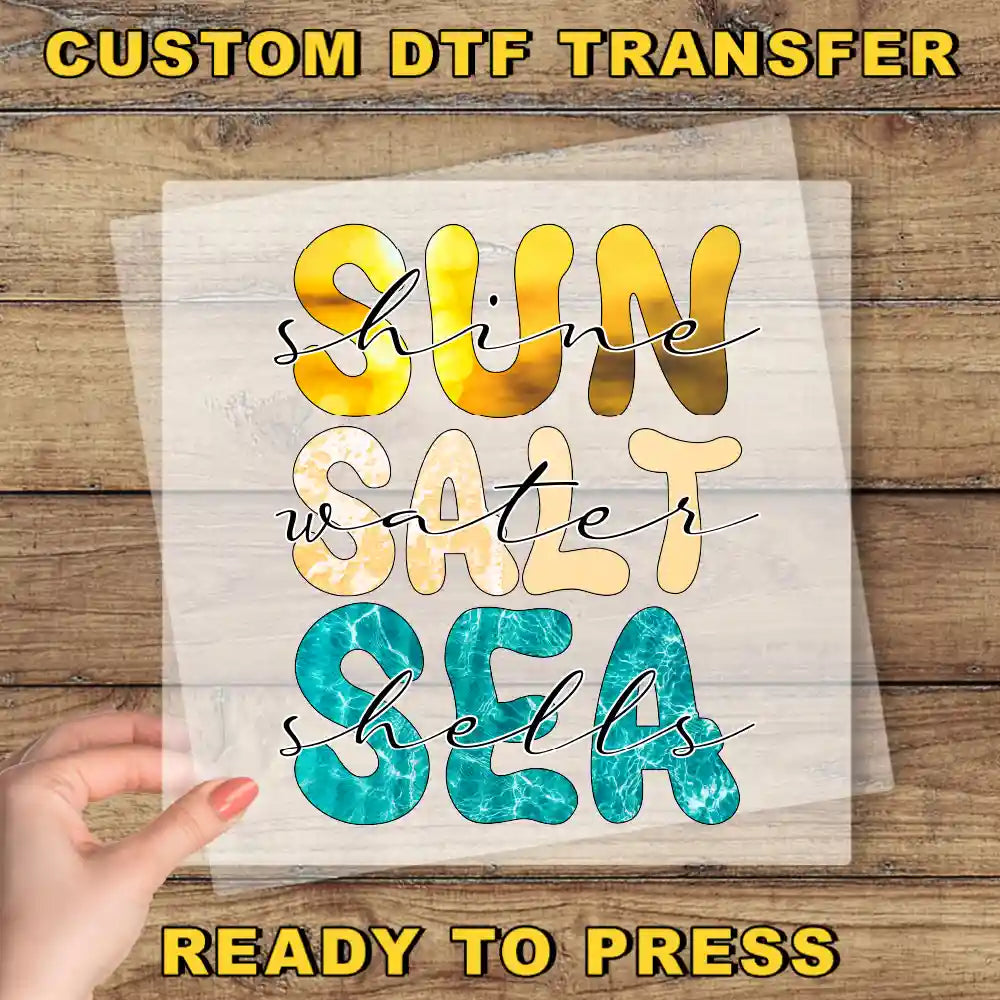 a hand holding a piece of paper that says sun safe sea ready to press