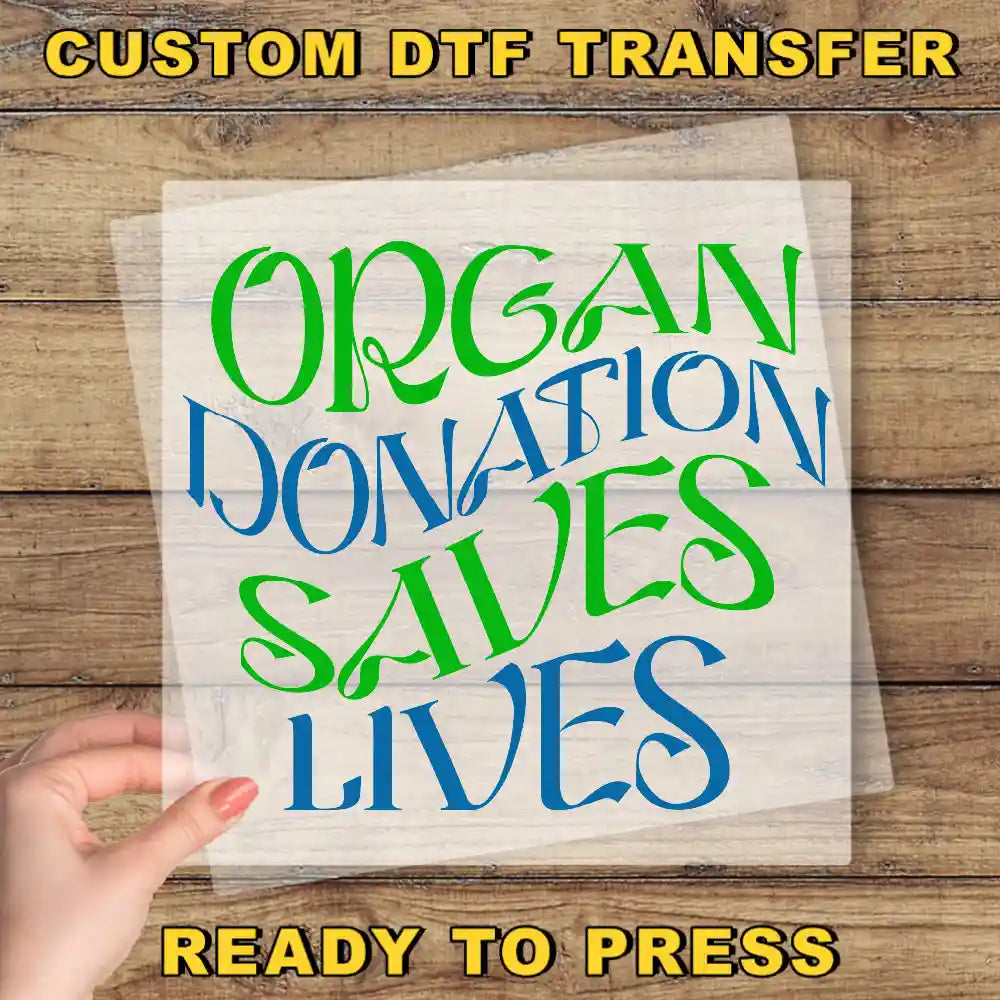 a hand holding a piece of paper that says organ donation saves lives