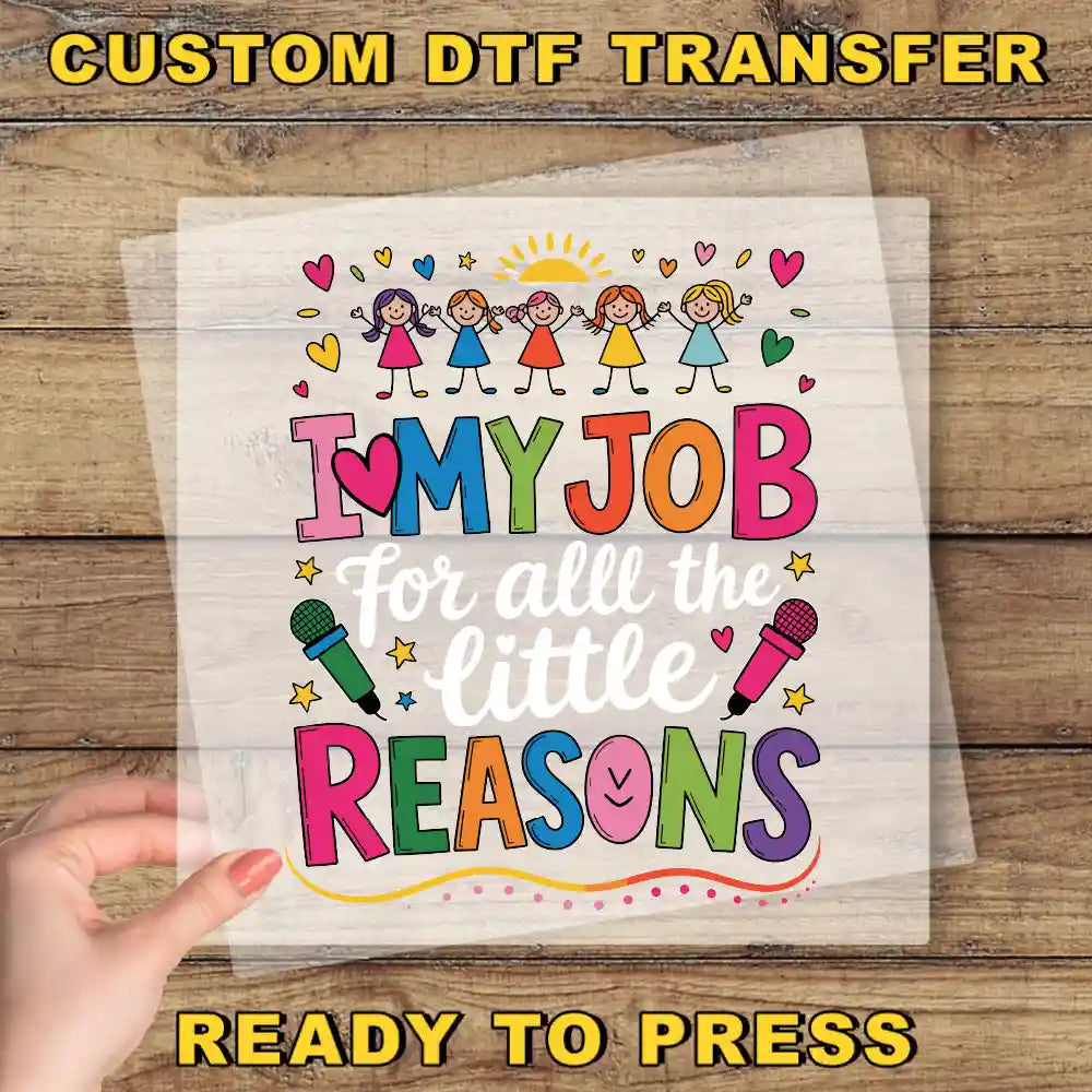 The image is a hand holding a clear sheet with a colorful and playful design featuring children and text.