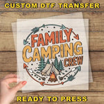 a hand holding a paper with the words family camping crew on it