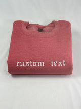a red t - shirt with a white wording on it