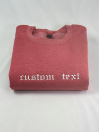 a red t - shirt with a white wording on it