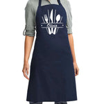 a woman wearing an apron with a knife and fork on it