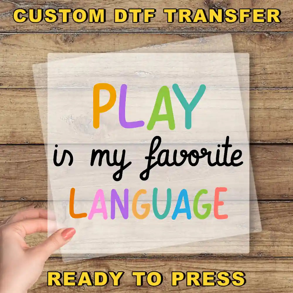 a hand holding a piece of paper that says play in my favorite language