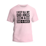 a pink t - shirt that says i keep all my dad jokes in a dad