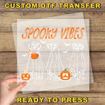 a person holding up a paper with a picture of two dogs on it