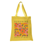 a yellow tote bag with a picture of flowers on it
