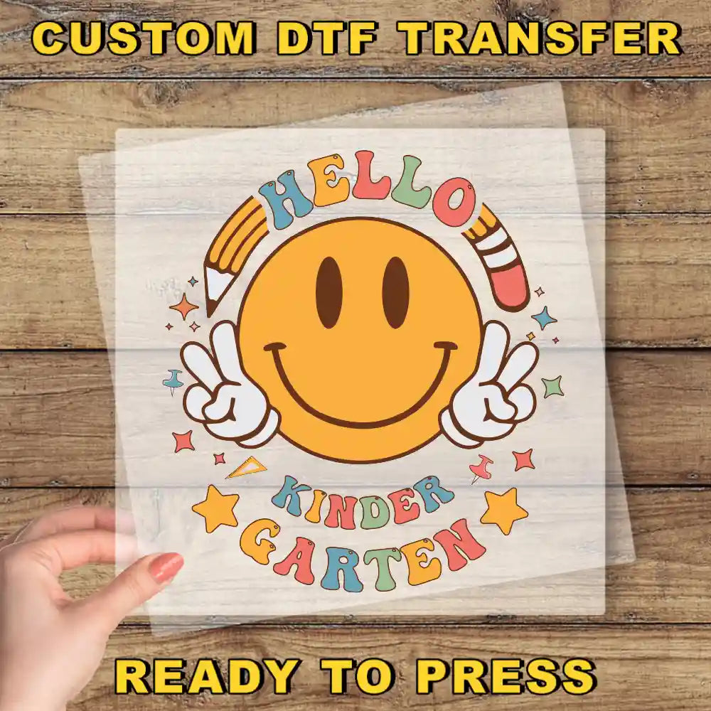 a person holding a piece of paper with a smiley face on it