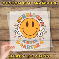 a person holding a piece of paper with a smiley face on it