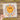 a person holding a piece of paper with a smiley face on it