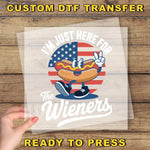 a person holding a piece of paper with a hot dog on it