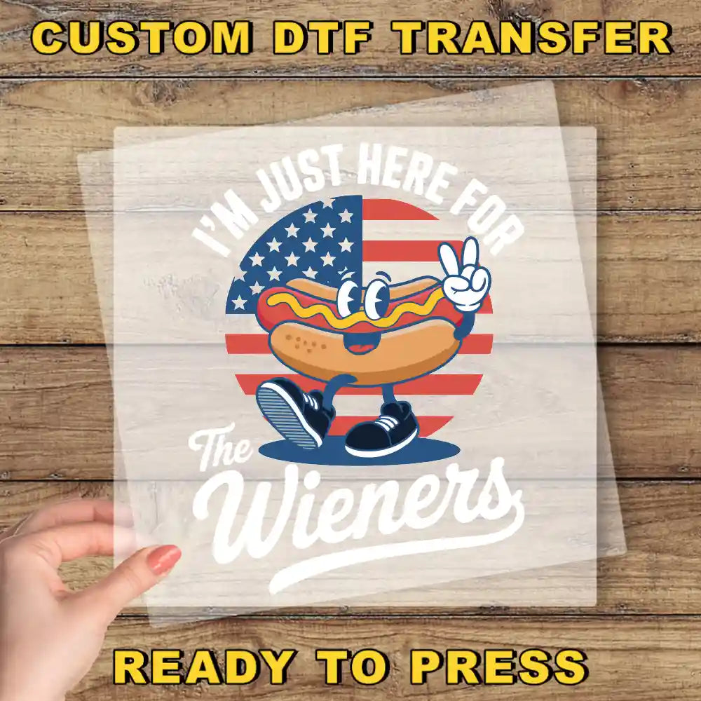 a person holding a piece of paper with a hot dog on it