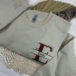 a t - shirt with the letter f on it next to a chain