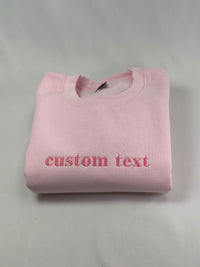 a pink t - shirt that says custom text