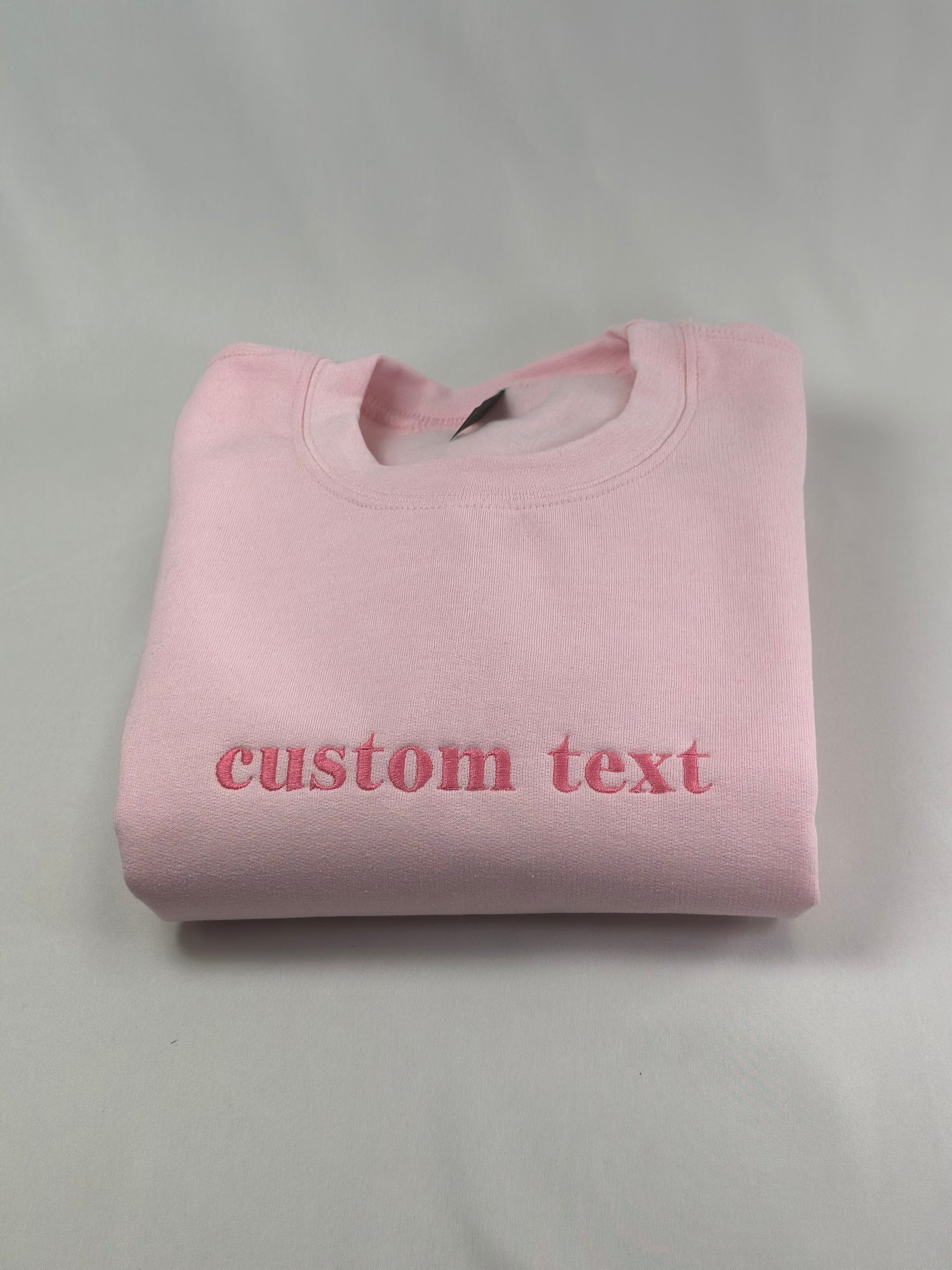 a pink t - shirt that says custom text
