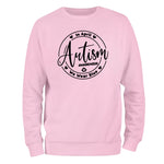 a pink sweatshirt with the words autism on it